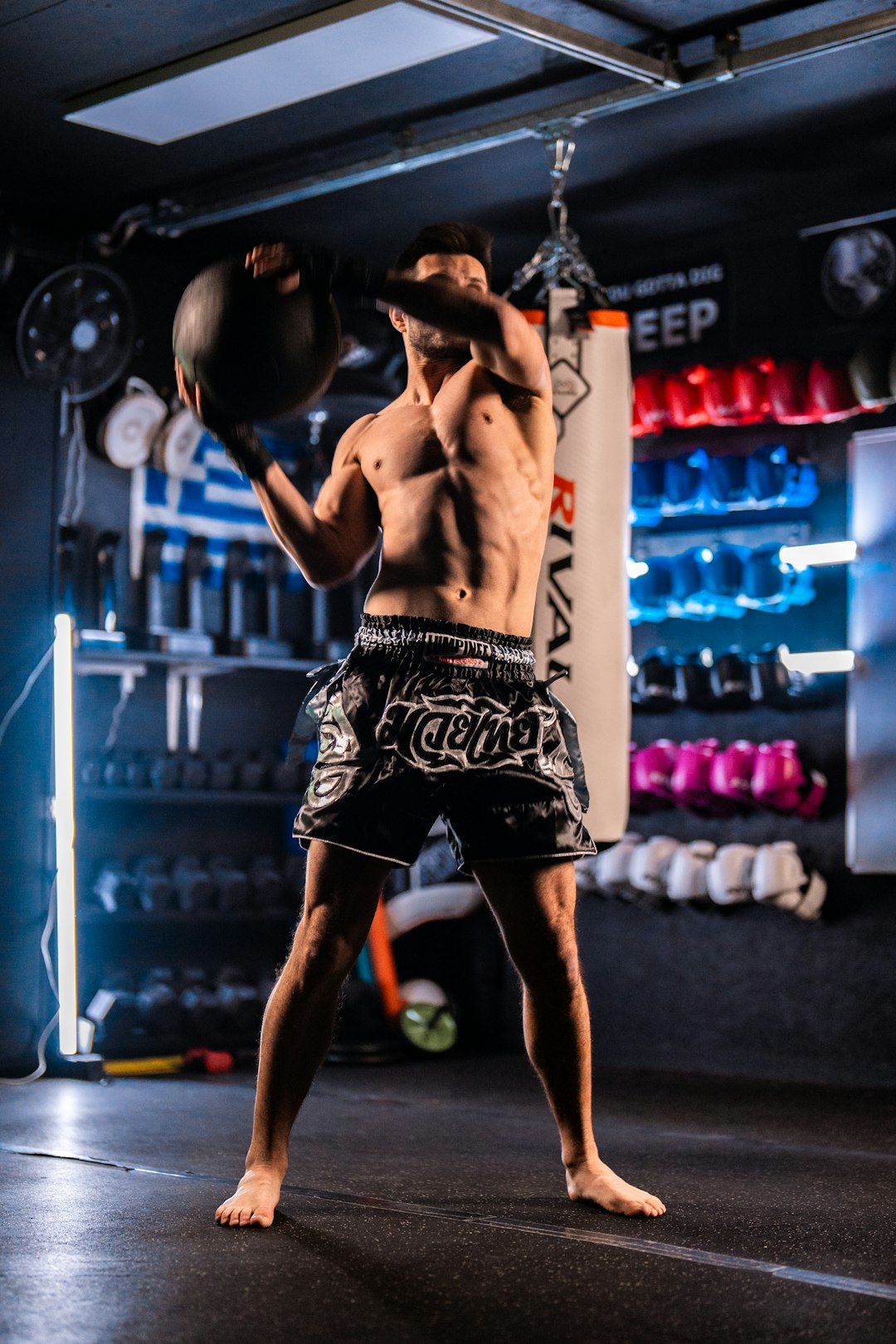 man-performing-a-medicine-ball-slam-in-a-gym-bfq0sw7mogm