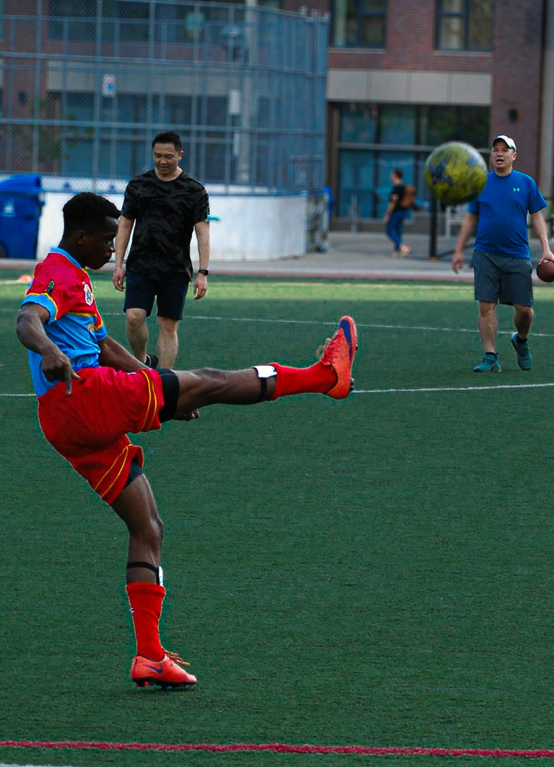 a-man-kicks-a-soccer-ball-on-a-field-9w8hs-x5nci